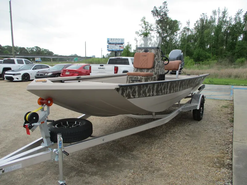 Slide: The Image of 2025 Avid 18 Rogue CC boat on trailer, parked outdoors. - 3