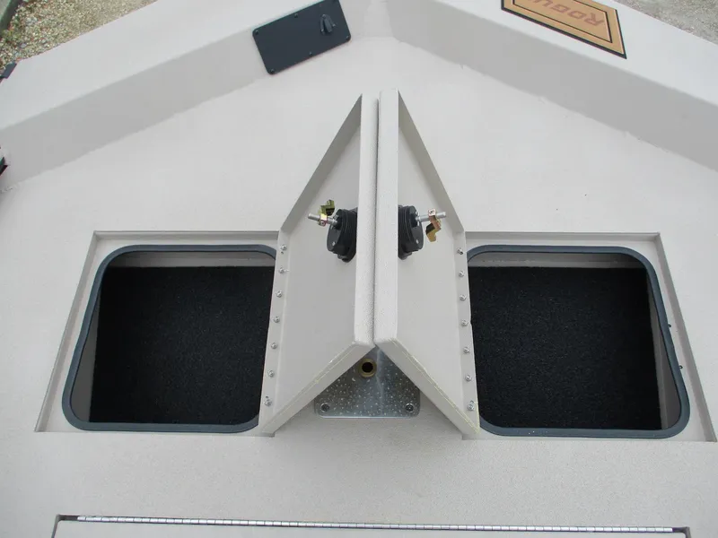 Slide: The Image of Avid 18 Rogue CC 2025 boat storage compartments with open hatches. - 8
