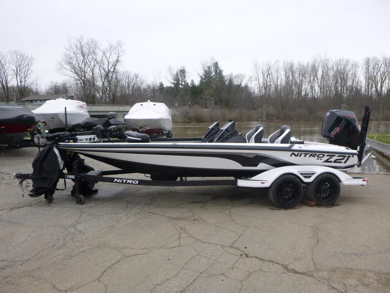 Slide: The Image of 2025 Nitro Z21 XL Pro boat on trailer, parked outdoors. - 0