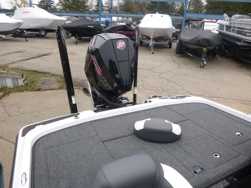 Slide: The Image of 2025 Nitro Z21 XL Pro boat with powerful outboard motor in a marina setting. - 11