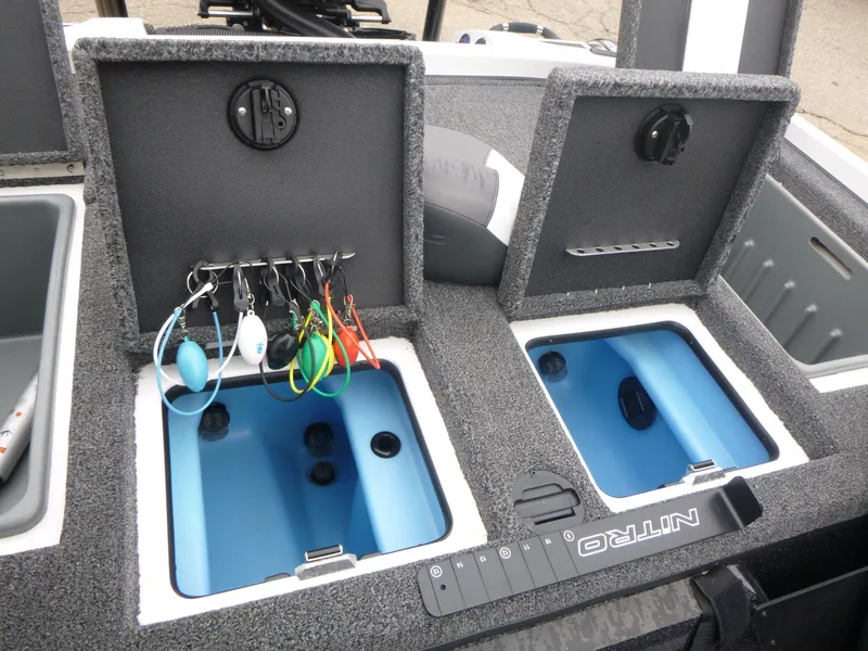 Slide: The Image of 2025 Nitro Z21 XL Pro boat storage compartments with fishing gear and tackle. - 12