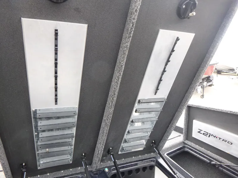 Slide: The Image of 2025 Nitro Z21 XL Pro boat storage compartments with organized tackle storage system. - 22