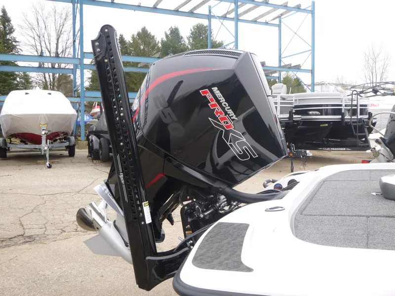 Slide: The Image of 2025 Nitro Z21 XL Pro boat with Mercury Pro XS engine in a marina setting. - 29