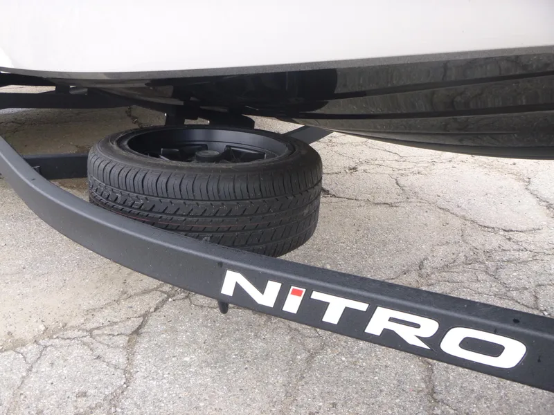 Slide: The Image of 2025 Nitro Z21 XL Pro trailer with spare tire on pavement. - 36