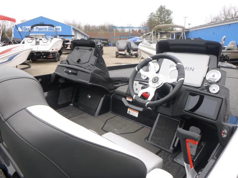 Slide: The Image of 2025 Nitro Z21 XL Pro boat interior with steering wheel and dashboard controls. - 4
