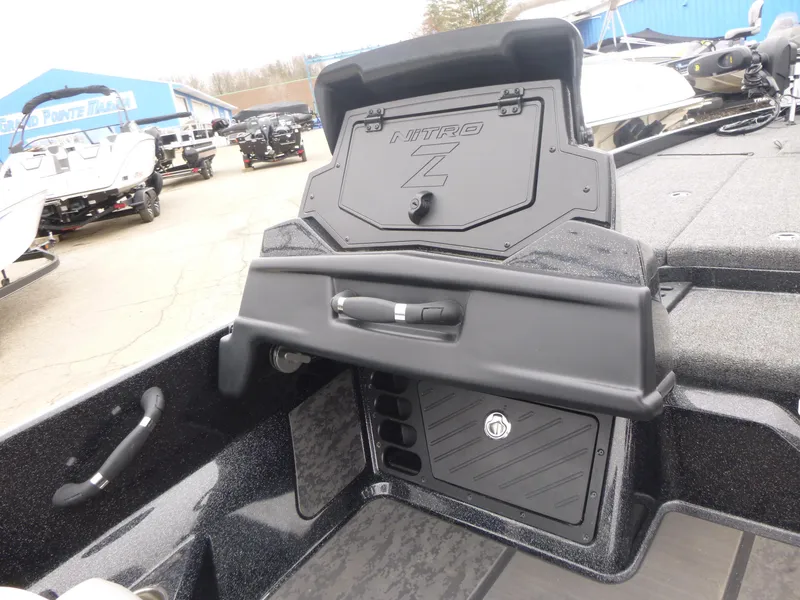 Slide: The Image of 2025 Nitro Z21 XL Pro boat dashboard with storage compartment, displayed outdoors. - 9