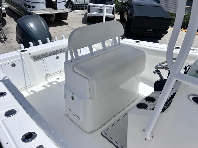 Slide: The Image of 2017 Cape Horn 22 OS boat interior with white seating and console. - 17