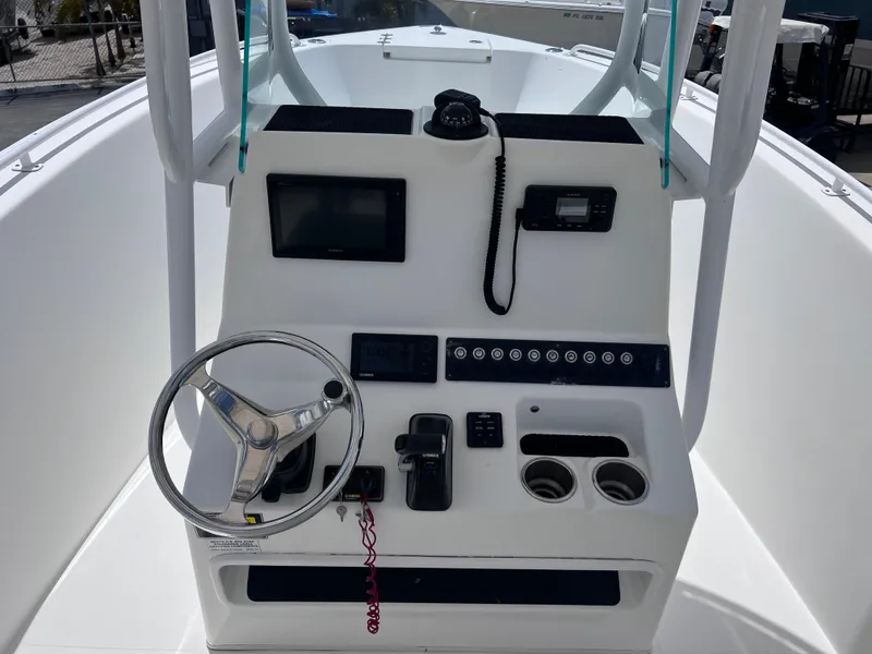 Slide: The Image of 2017 Cape Horn 22 OS boat console with steering wheel and navigation equipment. - 19