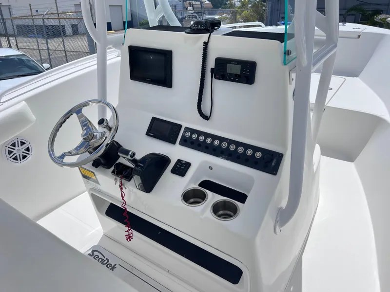 Slide: The Image of 2017 Cape Horn 22 OS boat console with steering wheel, controls, and electronics. - 20