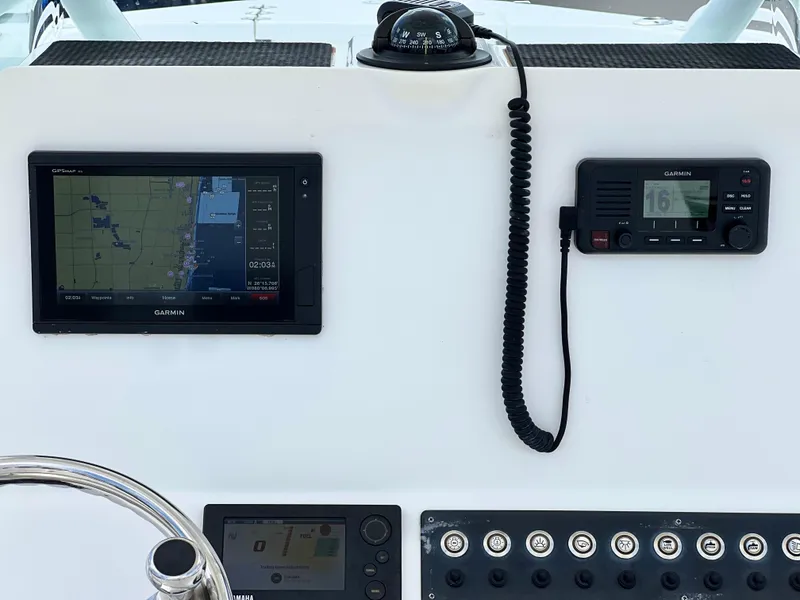 Slide: The Image of Dashboard of a 2017 Cape Horn 22 OS boat with navigation and communication equipment. - 22