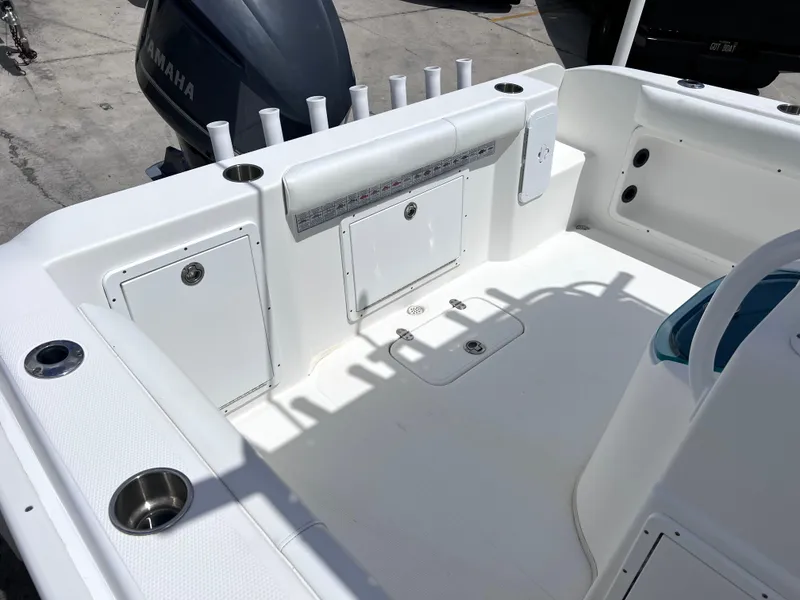 Slide: The Image of 2017 Cape Horn 22 OS boat deck with storage compartments and rod holders. - 25
