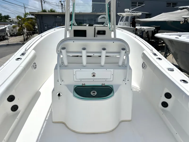 Slide: The Image of 2017 Cape Horn 22 OS boat interior with rod holders and storage compartments. - 29