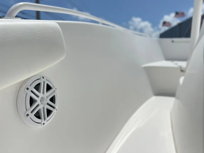Slide: The Image of 2017 Cape Horn 22 OS boat interior with speaker, sleek white design. - 32