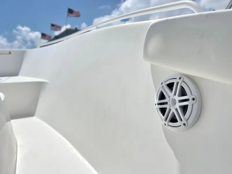 Slide: The Image of 2017 Cape Horn 22 OS boat with speaker, American flags, and clear sky. - 33