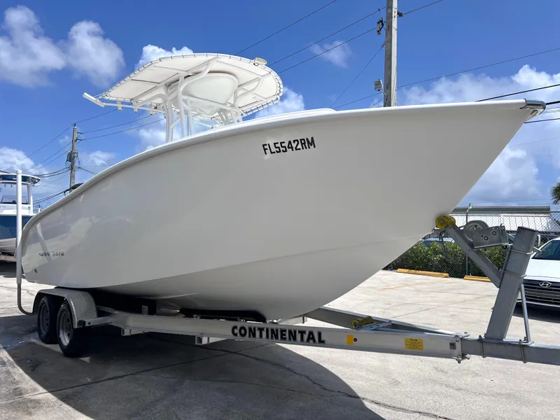 Slide: The Image of 2017 Cape Horn 22 OS boat on trailer under clear blue sky. - 4