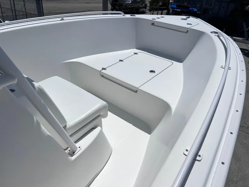 Slide: The Image of 2017 Cape Horn 22 OS boat deck with storage compartments and fishing rod holders. - 9