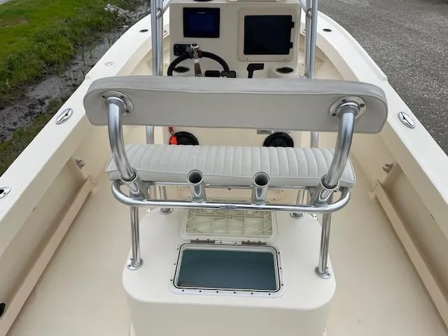 Slide: The Image of 2013 Parker 21 SE boat interior with seating, rod holders, and control panel. - 17