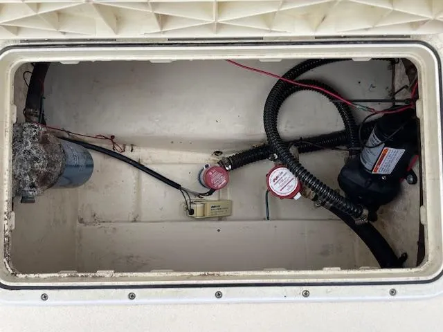 Slide: The Image of Boat storage compartment with wiring and components, Parker 21 SE, 2013 model. - 19