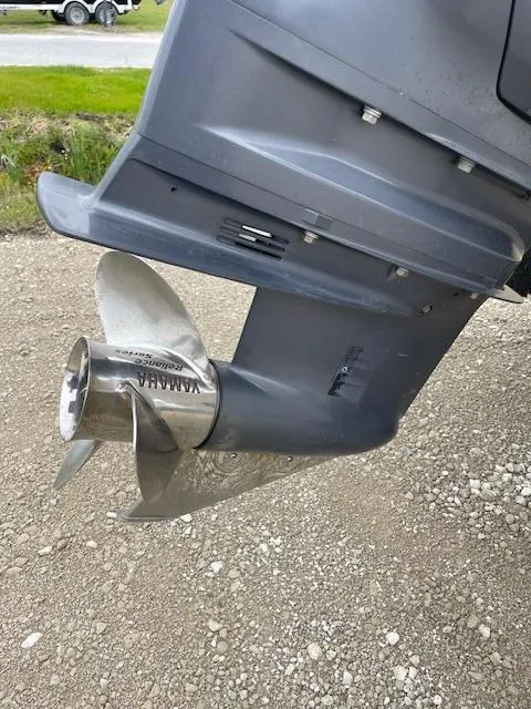 Slide: The Image of Close-up of a Parker 21 SE 2013 boat propeller on gravel surface. - 21