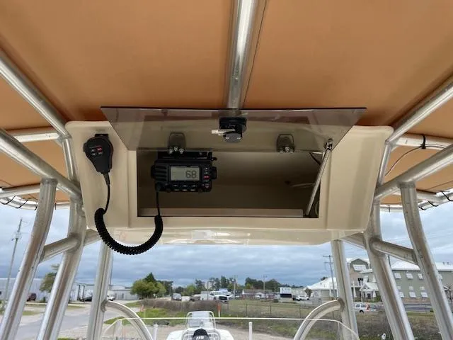 Slide: The Image of 2013 Parker 21 SE boat console with radio and microphone under canopy. - 9