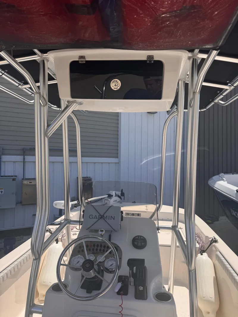 Slide: The Image of 2024 Carolina Skiff 21 LS boat console with Garmin navigation system and steering wheel. - 11