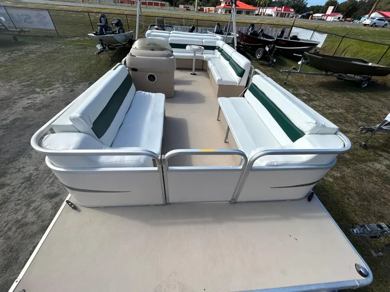 Slide: The Image of 2004 Godfrey Tuscany 220 pontoon boat with spacious seating and open deck layout. - 5