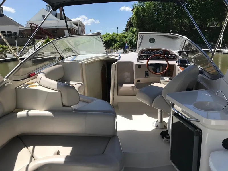 Slide: The Image of 1999 Regal 292 Commodore boat interior with seating, steering wheel, and dashboard. - 5