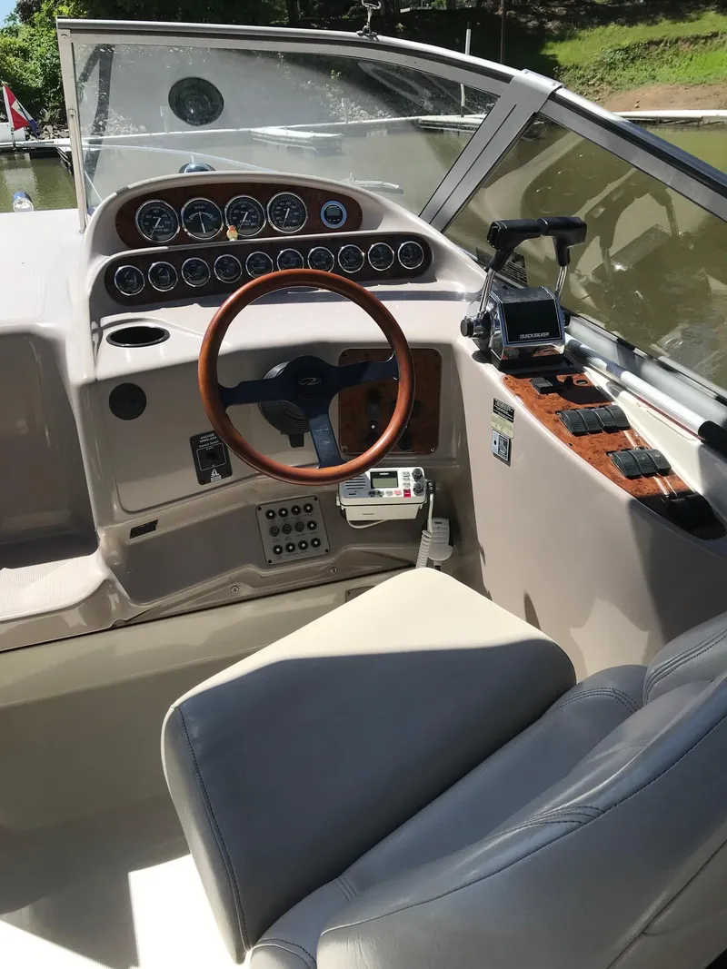 Slide: The Image of 1999 Regal 292 Commodore boat cockpit with steering wheel and instrument panel. - 6