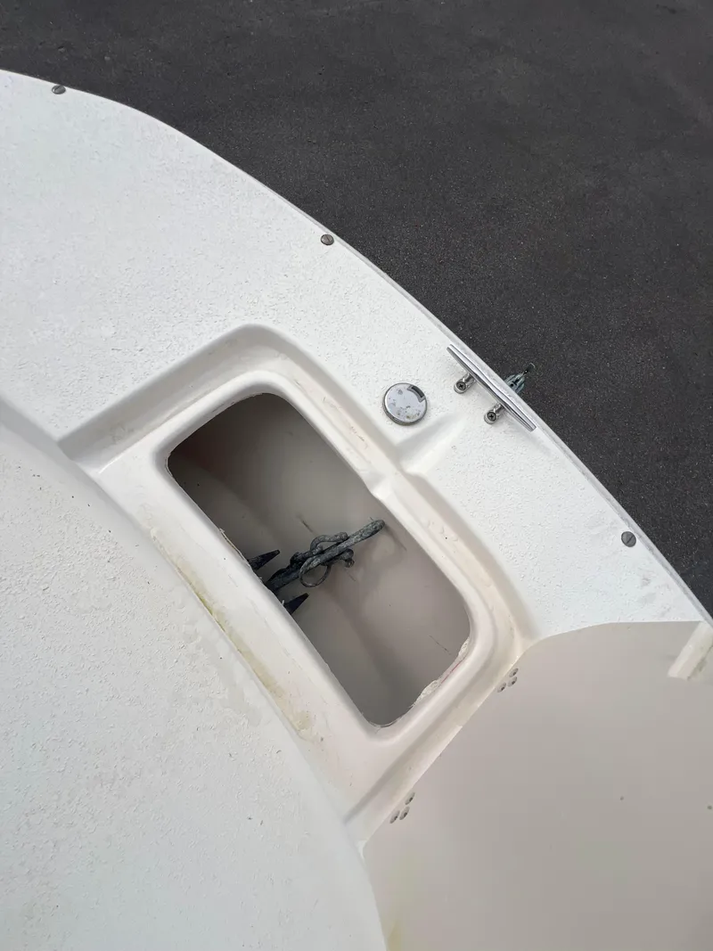 Slide: The Image of 2019 Carolina Skiff 218 DLV boat deck with storage compartment. - 13