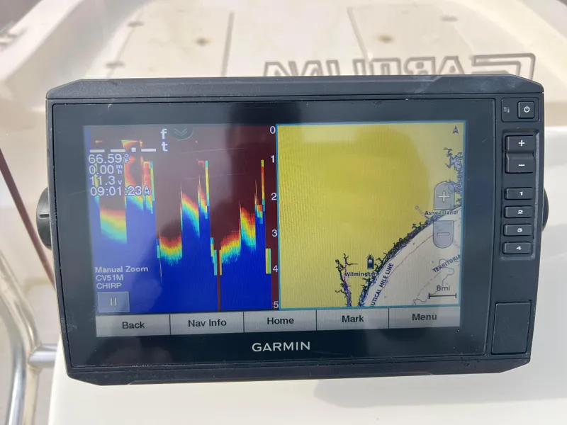 Slide: The Image of Garmin fishfinder on 2019 Carolina Skiff 218 DLV displaying sonar and navigation data. - 16