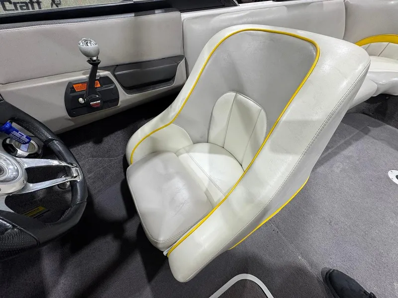 Slide: The Image of 2007 Malibu Sunscape 23 LSV interior with white and yellow-trimmed seat, steering wheel, and controls. - 13