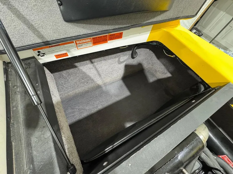 Slide: The Image of Open storage compartment in a 2007 Malibu Sunscape 23 LSV boat. - 17