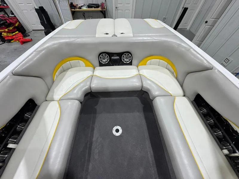 Slide: The Image of 2007 Malibu Sunscape 23 LSV boat interior with gray and yellow seating. - 6