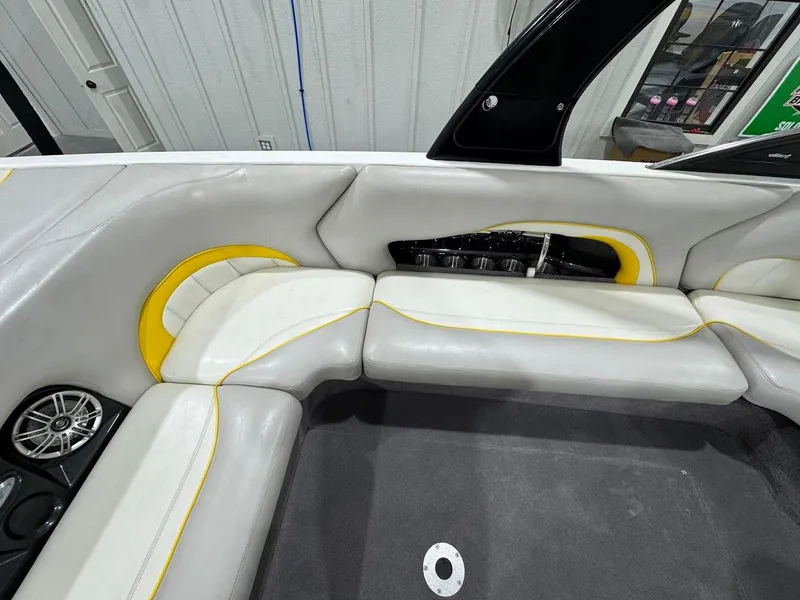 Slide: The Image of 2007 Malibu Sunscape 23 LSV interior with gray and yellow seating, speaker, and cup holders. - 8
