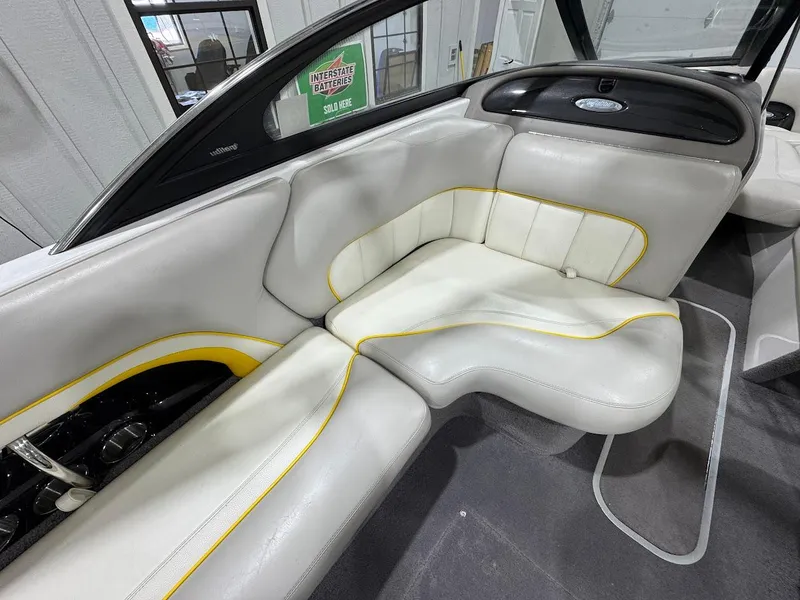 Slide: The Image of 2007 Malibu Sunscape 23 LSV interior with white and yellow seating. - 9