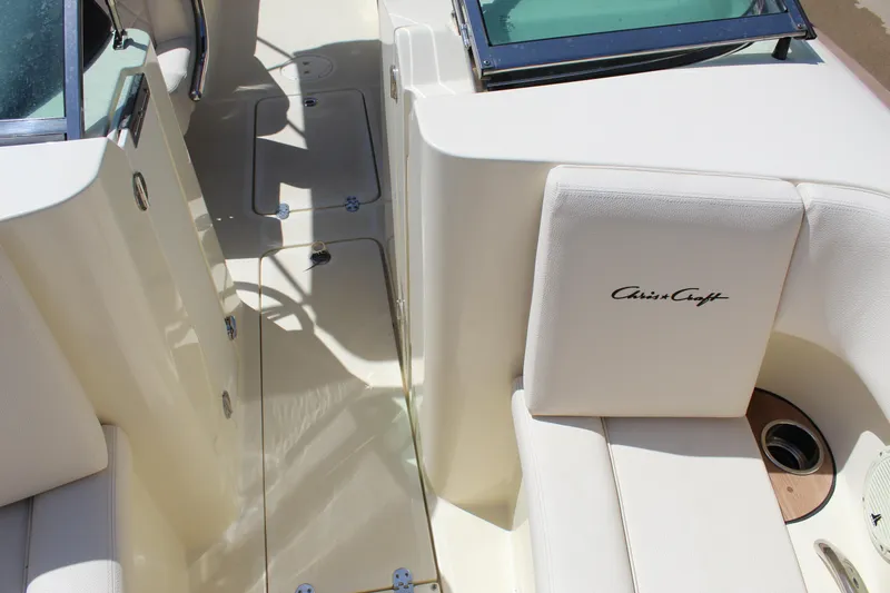 Slide: The Image of 2022 Chris-Craft Launch 27 interior with white seating and sleek design. - 12