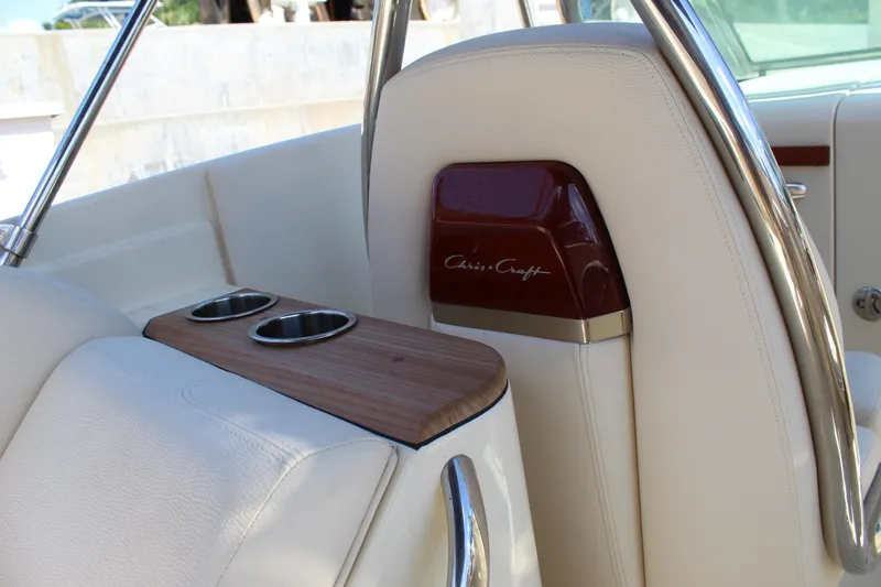 Slide: The Image of 2022 Chris-Craft Launch 27 interior with cup holders and elegant design. - 23