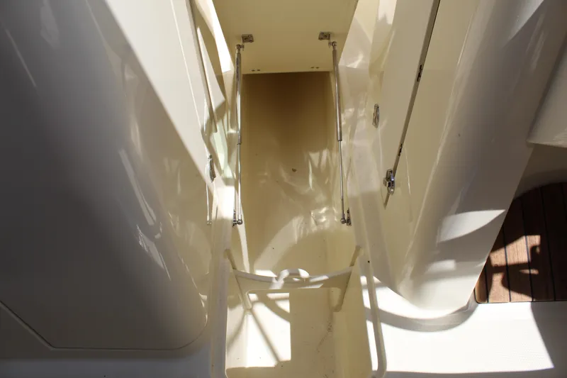 Slide: The Image of 2022 Chris-Craft Launch 27 interior stairway with sleek design and polished surfaces. - 26