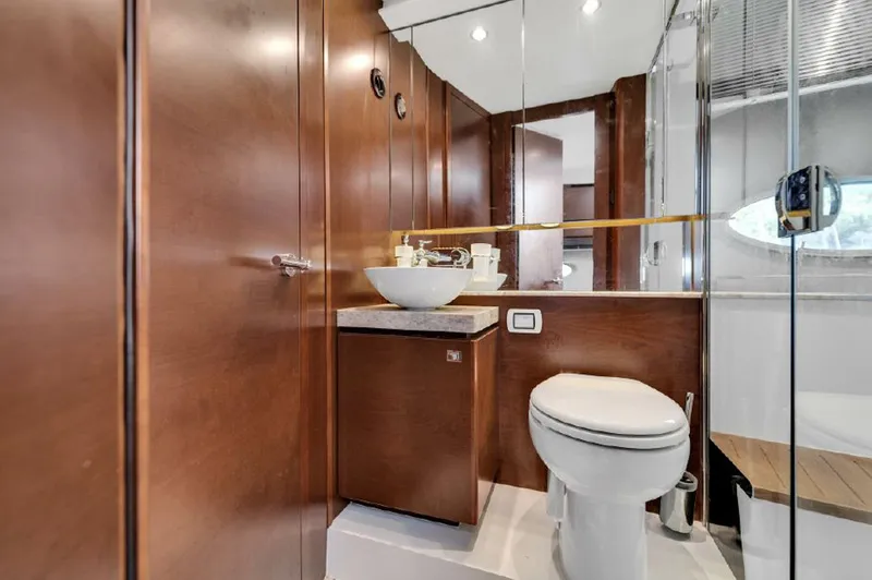 Slide: The Image of Luxurious bathroom in 2016 Princess V39 yacht with modern fixtures and wooden cabinetry. - 23