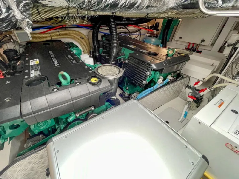 Slide: The Image of Engine room of a 2016 Princess V39 yacht, showcasing dual engines and mechanical components. - 28
