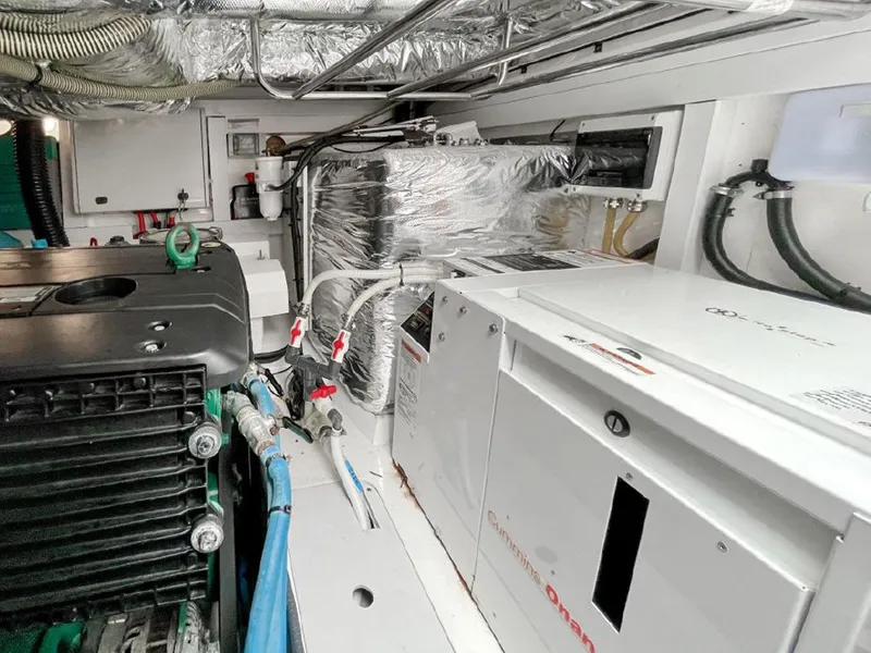 Slide: The Image of Engine room of a 2016 Princess V39 yacht, featuring mechanical and electrical components. - 29