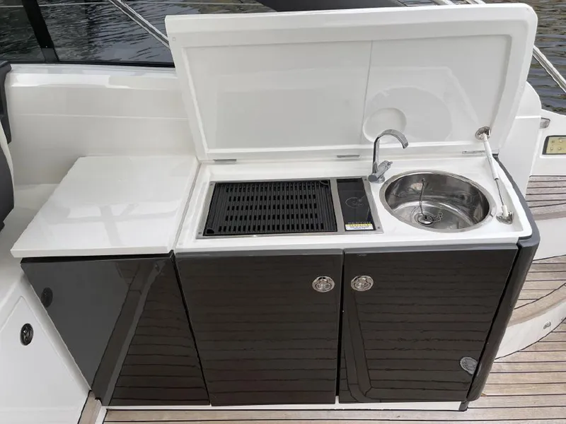 Slide: The Image of Outdoor kitchenette on 2016 Princess V39 yacht with sink and grill. - 8