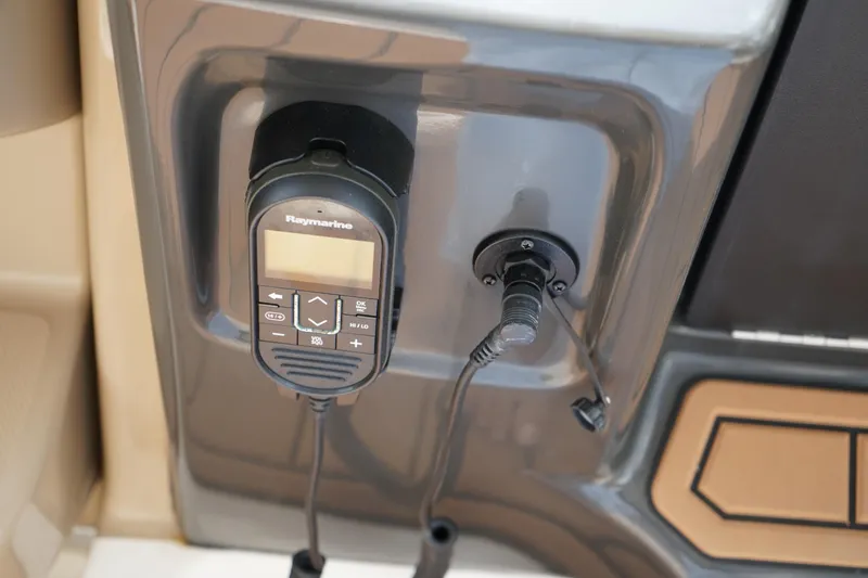 Slide: The Image of Raymarine radio installed on 2016 Sea Ray 330 Sundancer boat dashboard. - 20