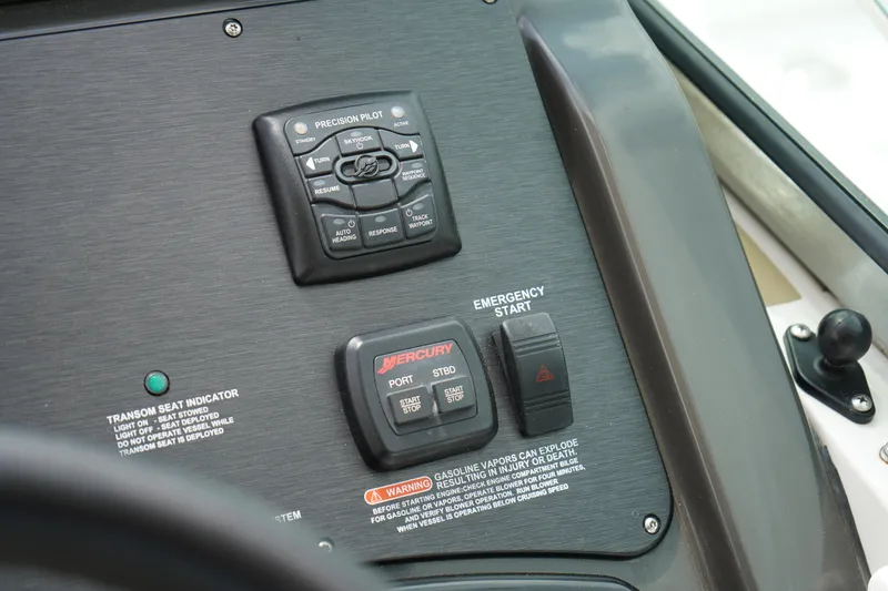 Slide: The Image of Control panel of a 2016 Sea Ray 330 Sundancer boat with emergency start and navigation controls. - 22