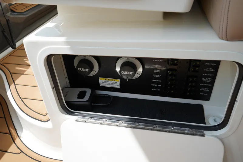 Slide: The Image of Control panel of 2016 Sea Ray 330 Sundancer boat, featuring dials and switches. - 25