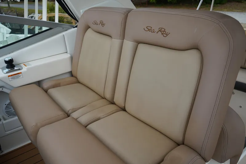 Slide: The Image of 2016 Sea Ray 330 Sundancer beige leather seating, luxurious boat interior. - 28