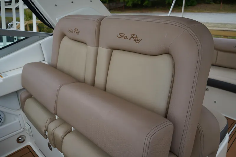 Slide: The Image of 2016 Sea Ray 330 Sundancer boat seats with beige leather upholstery. - 29