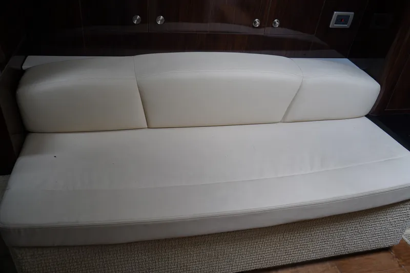 Slide: The Image of White leather seating in 2016 Sea Ray 330 Sundancer yacht interior. - 48