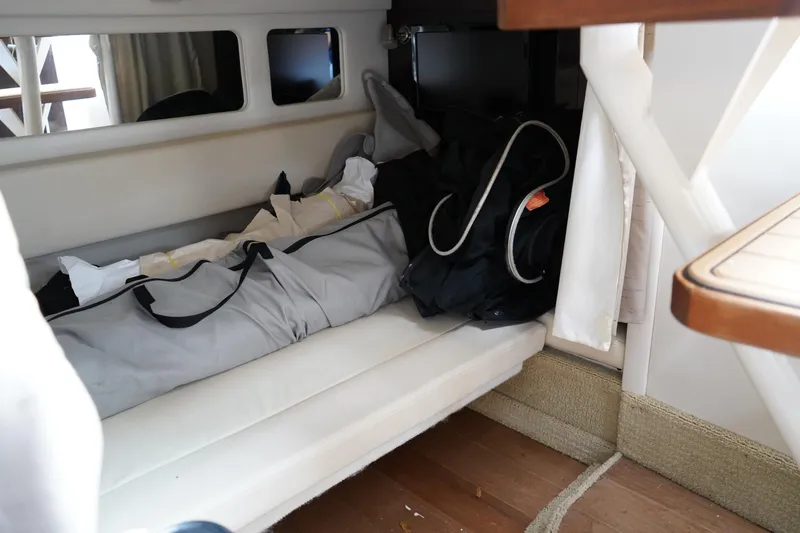 Slide: The Image of Interior cabin of 2016 Sea Ray 330 Sundancer with storage and seating area. - 49