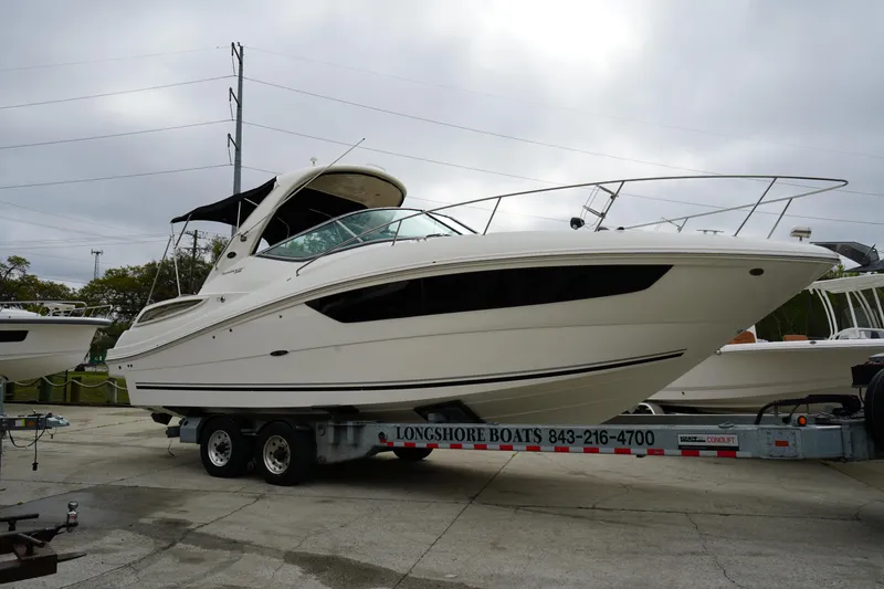 Slide: The Image of 2016 Sea Ray 330 Sundancer boat on trailer at Longshore Boats dealership. - 5